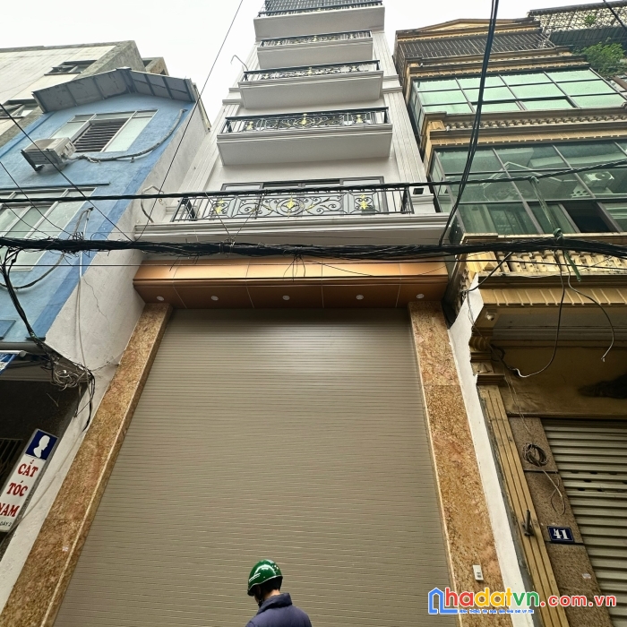 Bán tòa nhà vp khu phân lô đền lừ 70m * 7t mặt tiền 5.5m, ô tô tránh 15 tỷ, thang máy, nhà mới.